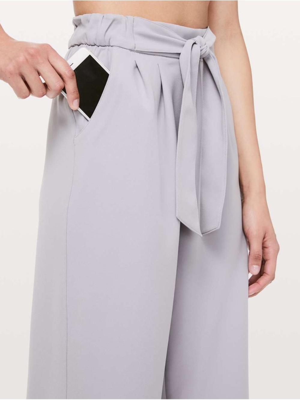 Lululemon light gray wide-leg pants with elastic waist and tie-front detail.